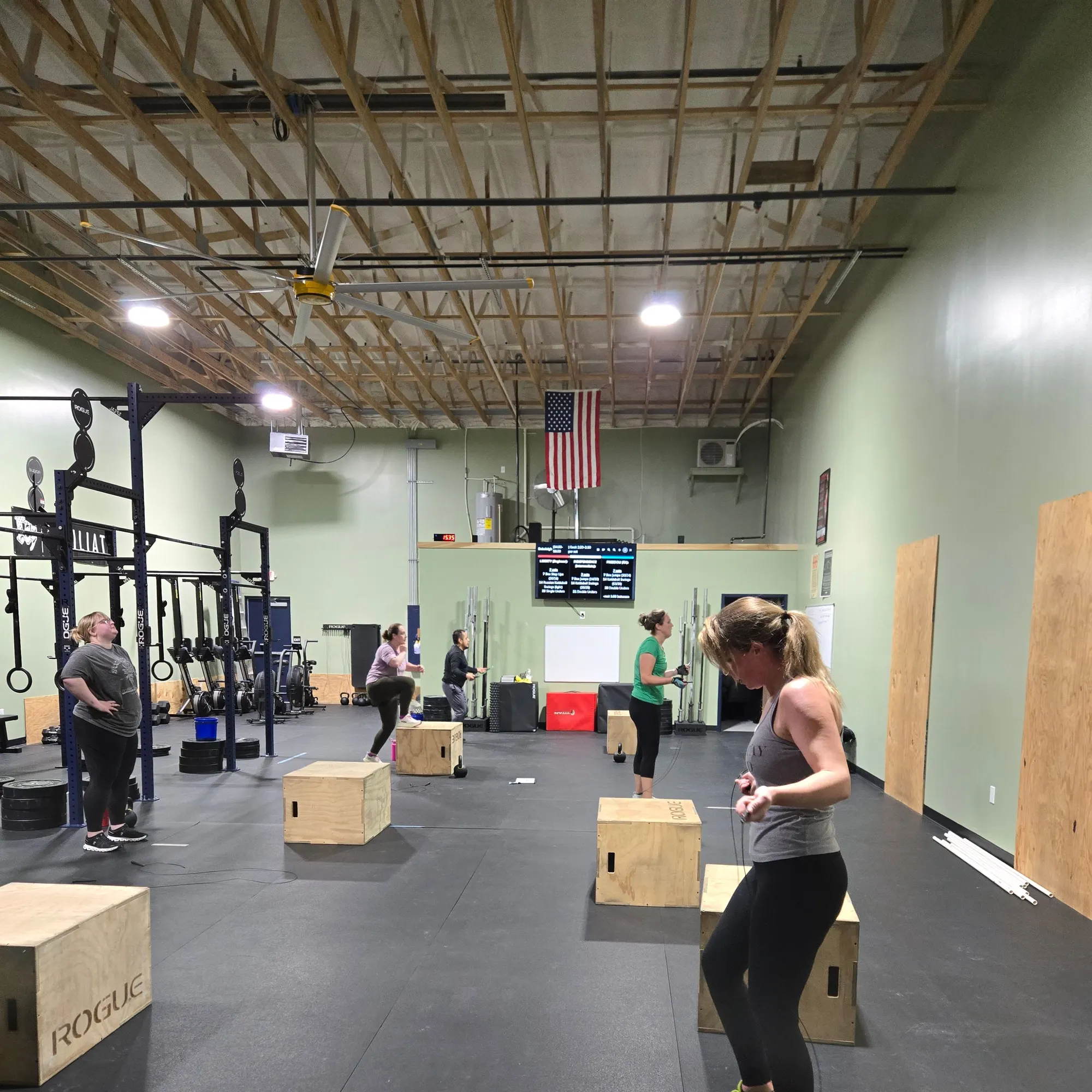 Morning group class doing box jumps at Whitestown Athletic Club